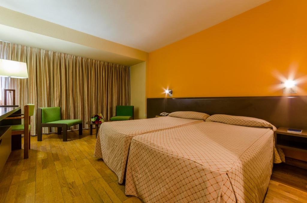 Postel nebo postele na pokoji v ubytování Hotel Sant Eloi