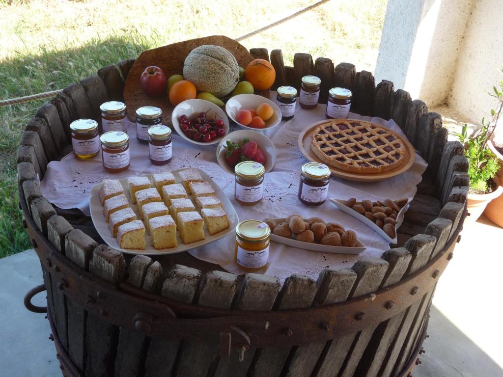 a basket filled with food and jams and waffles at Agriturismo La Tana di Lu Maccioni in Santa Teresa Gallura