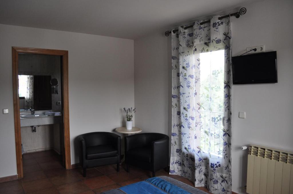 TV a/nebo společenská místnost v ubytování Hotel Langa