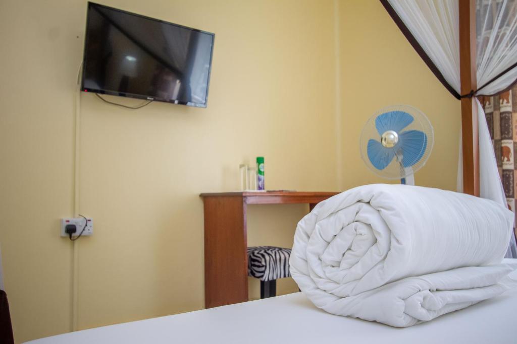 Postel nebo postele na pokoji v ubytování 2 Friends Guest House