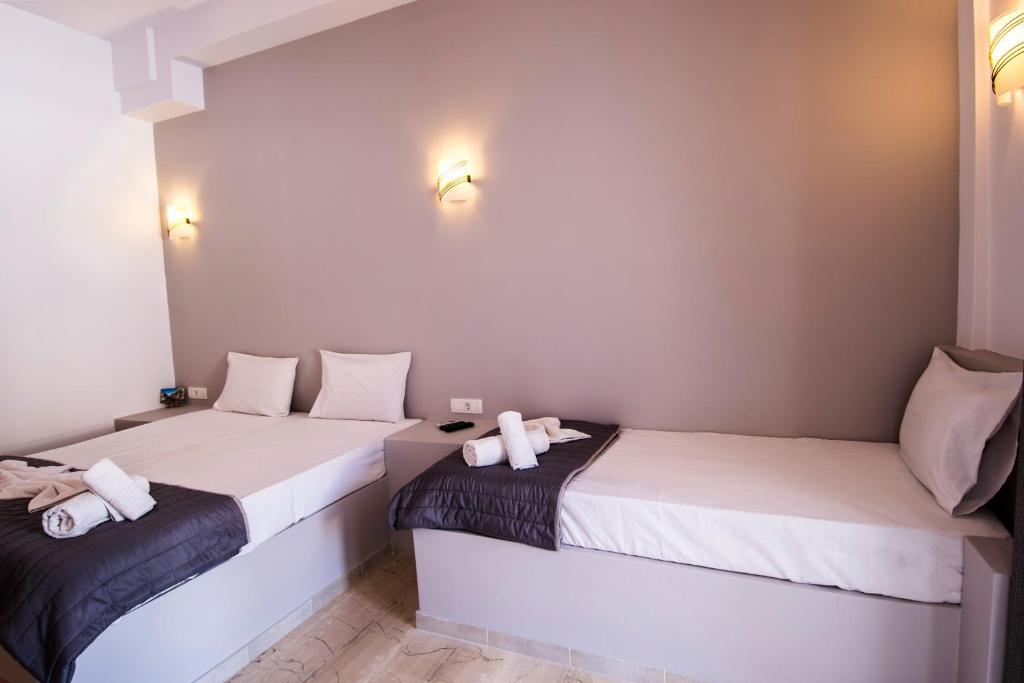 Postel nebo postele na pokoji v ubytování Katefiani Villas