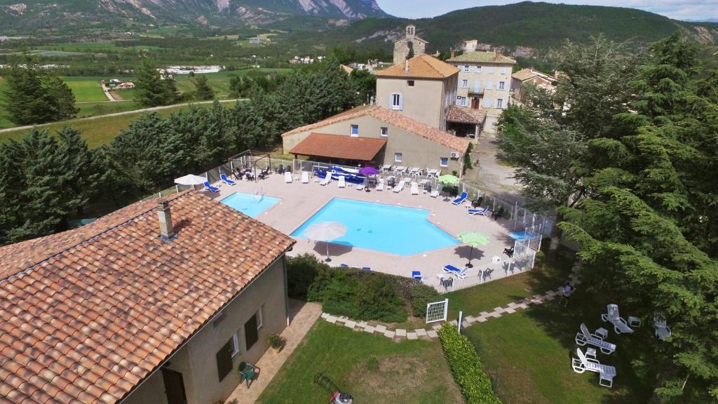 an aerial view of a house with a swimming pool at VVF Haute Provence in Lagrand