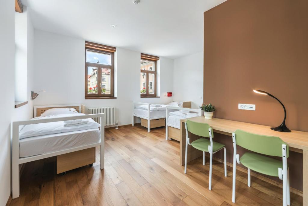 Postel nebo postele na pokoji v ubytování Hostel Bearlog Kočevje