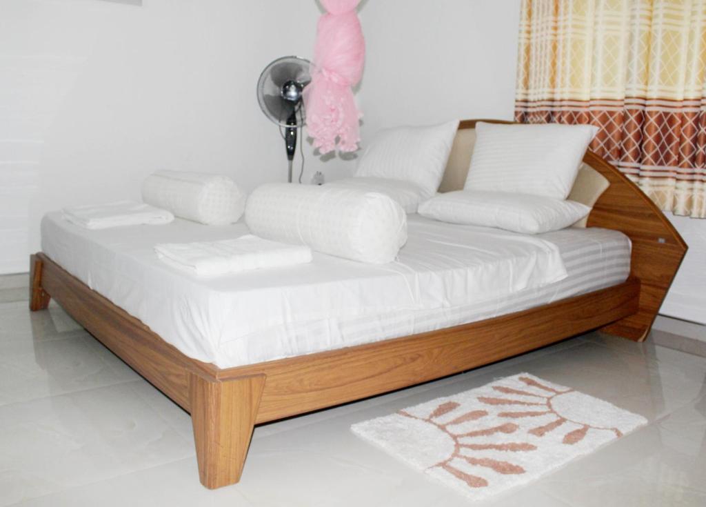 Postel nebo postele na pokoji v ubytování Fortune Rest Villa