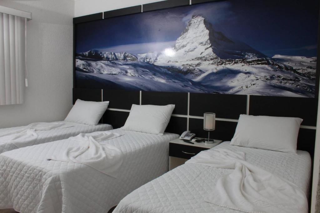 Cama ou camas em um quarto em Forest Hotel