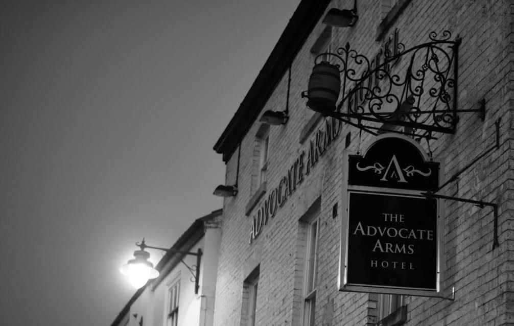 a sign hanging on the side of a building at Advocate Arms in Market Rasen