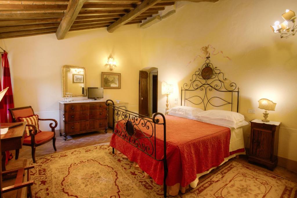 Postel nebo postele na pokoji v ubytování Relais Villa Baldelli