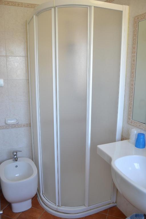 Koupelna v ubytování Hotel Apis