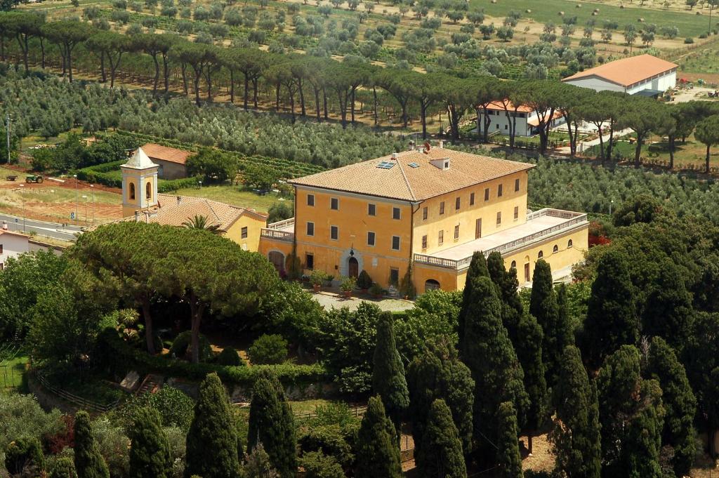 an aerial view of a large building with trees at Terre Regionali Toscane in Alberese