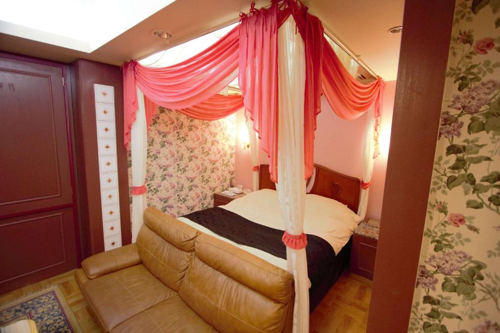 Postel nebo postele na pokoji v ubytování Hotel LaLa (Adult Only)