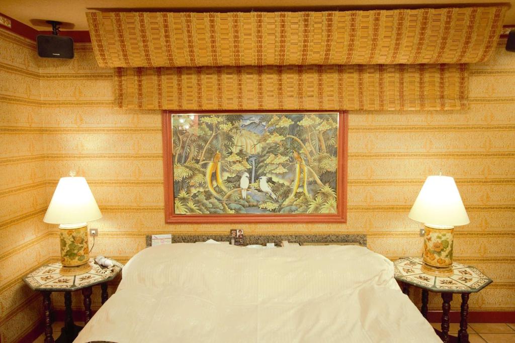 Postel nebo postele na pokoji v ubytování Hotel LaLa (Adult Only)