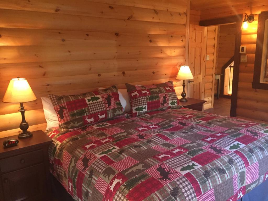 Postel nebo postele na pokoji v ubytování Selenia Lodge- Résidences et Chalets dans les Laurentides