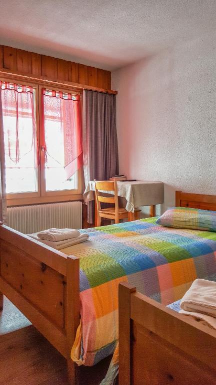Postel nebo postele na pokoji v ubytování Hotel Restaurant Monte Leone