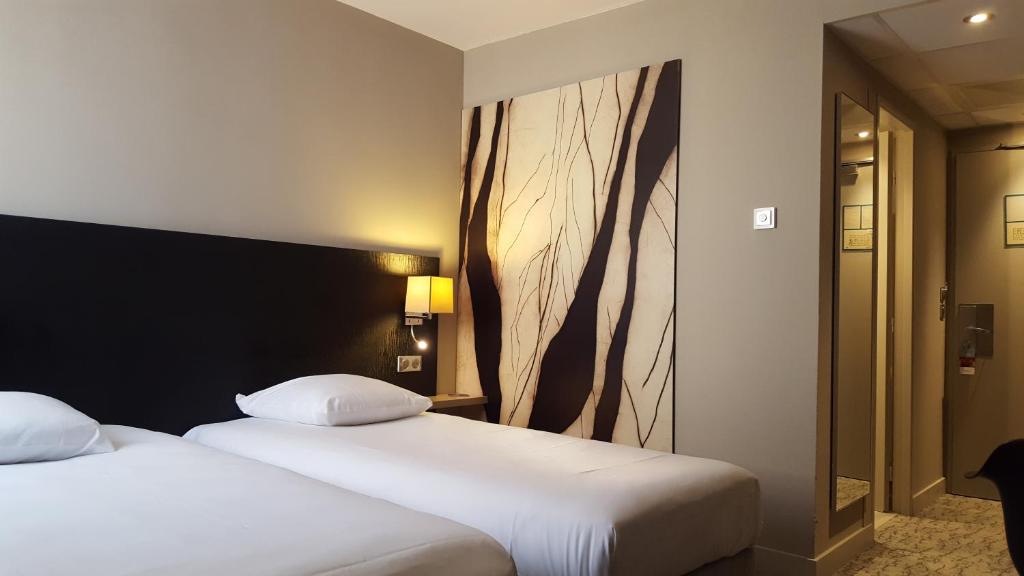 Postel nebo postele na pokoji v ubytování Mercure Colmar Centre Unterlinden