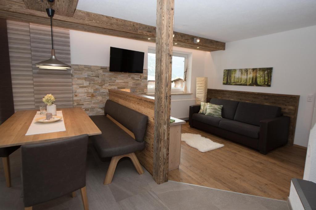 TV a/nebo společenská místnost v ubytování Inn-Apartments