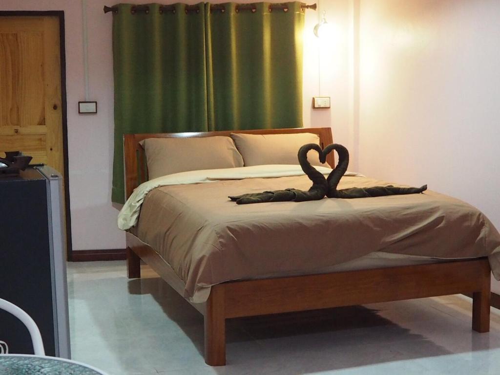 Postel nebo postele na pokoji v ubytování Smile Resort