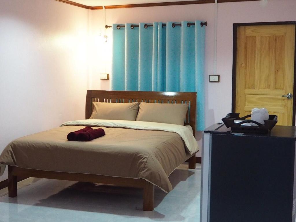 Postel nebo postele na pokoji v ubytování Smile Resort