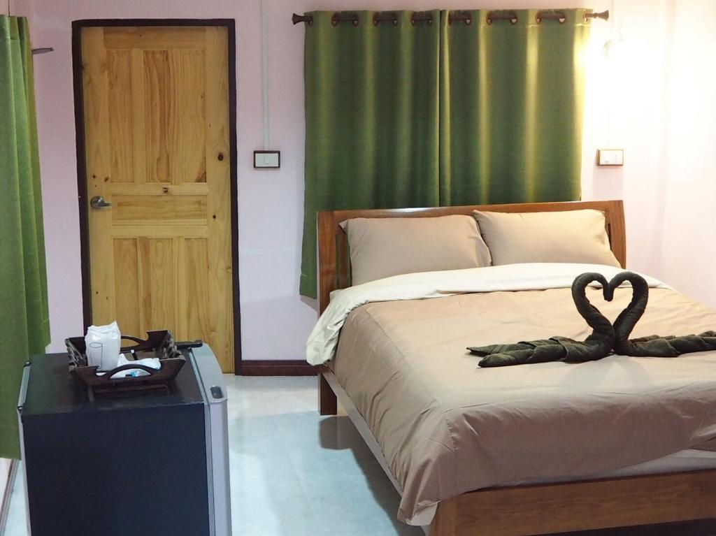 Postel nebo postele na pokoji v ubytování Smile Resort