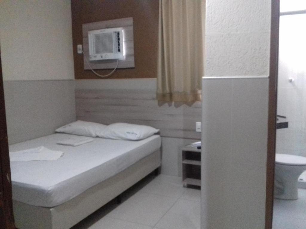 Cama ou camas em um quarto em Hotel Uzi Praia