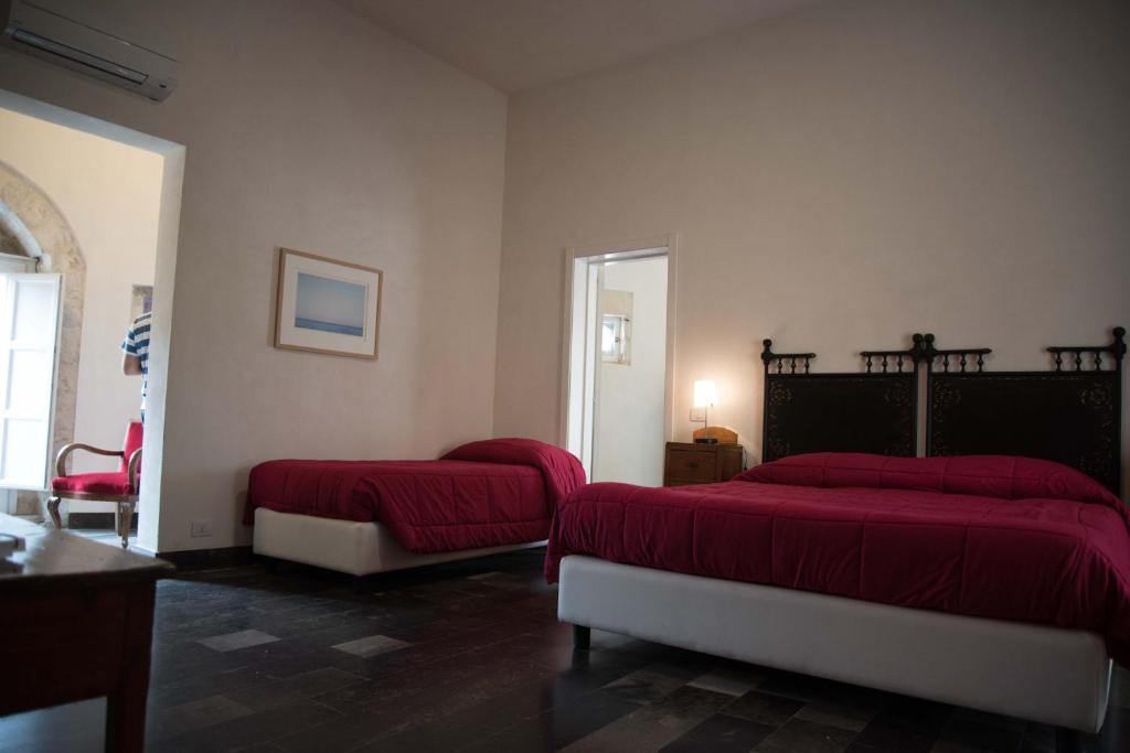 Postel nebo postele na pokoji v ubytování Hotel Dell'Orologio