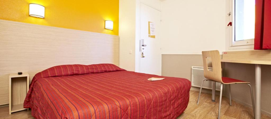 Postel nebo postele na pokoji v ubytování Hotel HECO Lyon sud Vienne