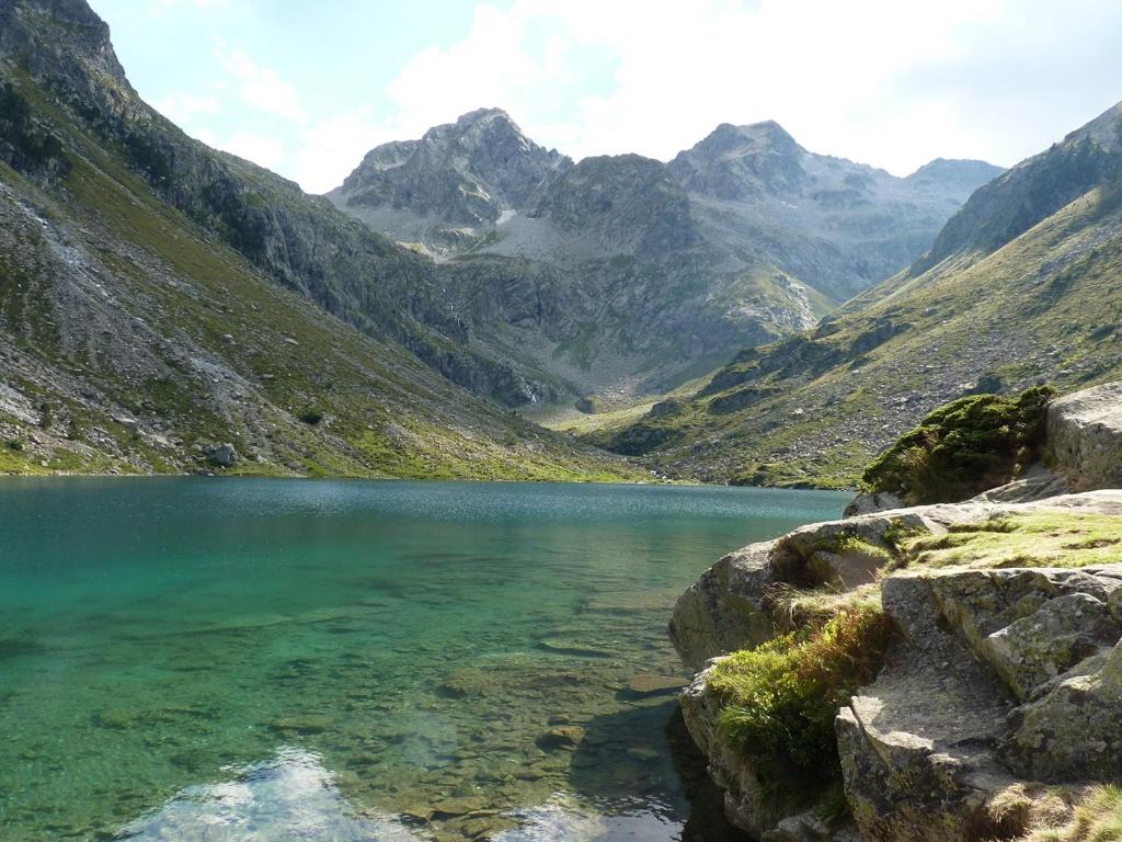a mountain lake in the middle of a valley at Chalet De Peyrelance in Cauterets