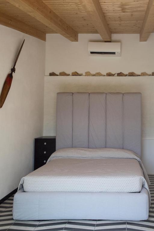 Postel nebo postele na pokoji v ubytování Orchidea