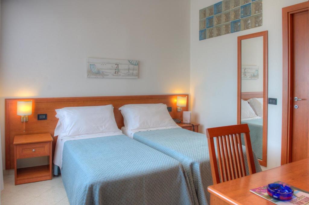 Кровать или кровати в номере Hotel Noris