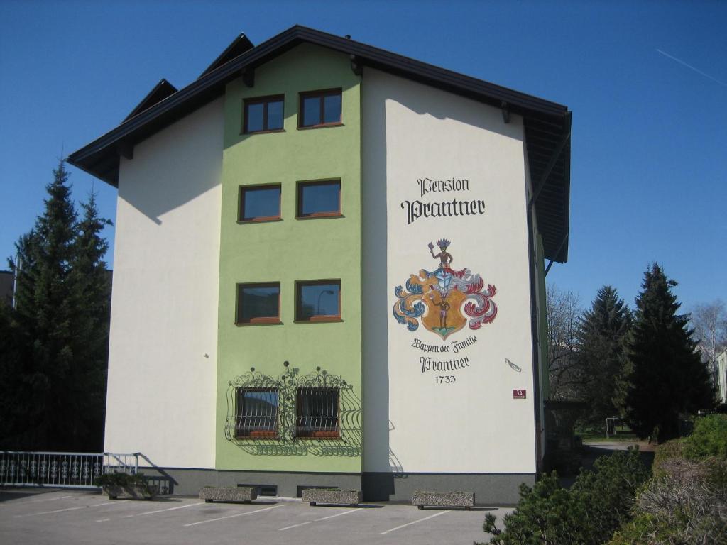 a building with a sign on the side of it at Pension Prantner in Innsbruck