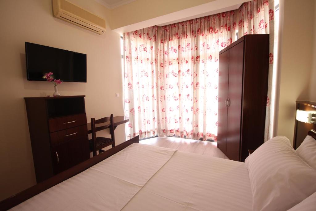 Postel nebo postele na pokoji v ubytování Hotel Ari