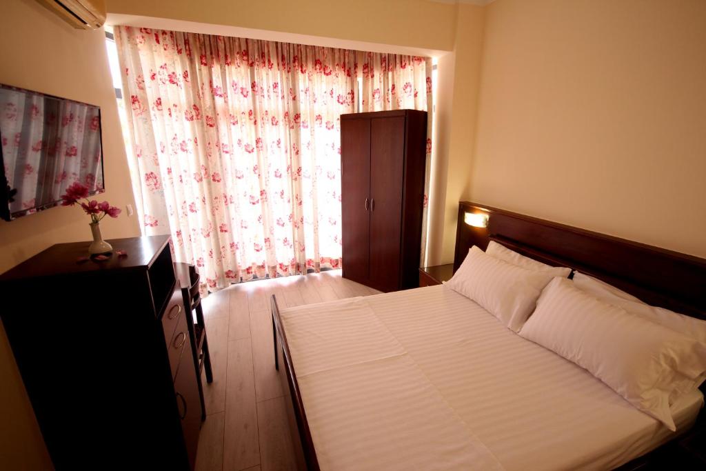 Postel nebo postele na pokoji v ubytování Hotel Ari