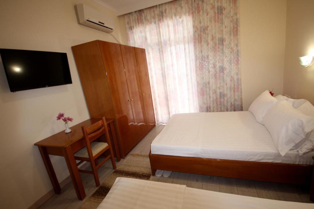 Postel nebo postele na pokoji v ubytování Hotel Ari