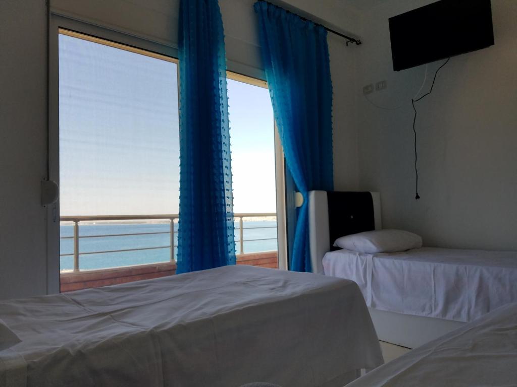 Postel nebo postele na pokoji v ubytování Sunset Hotel Roza