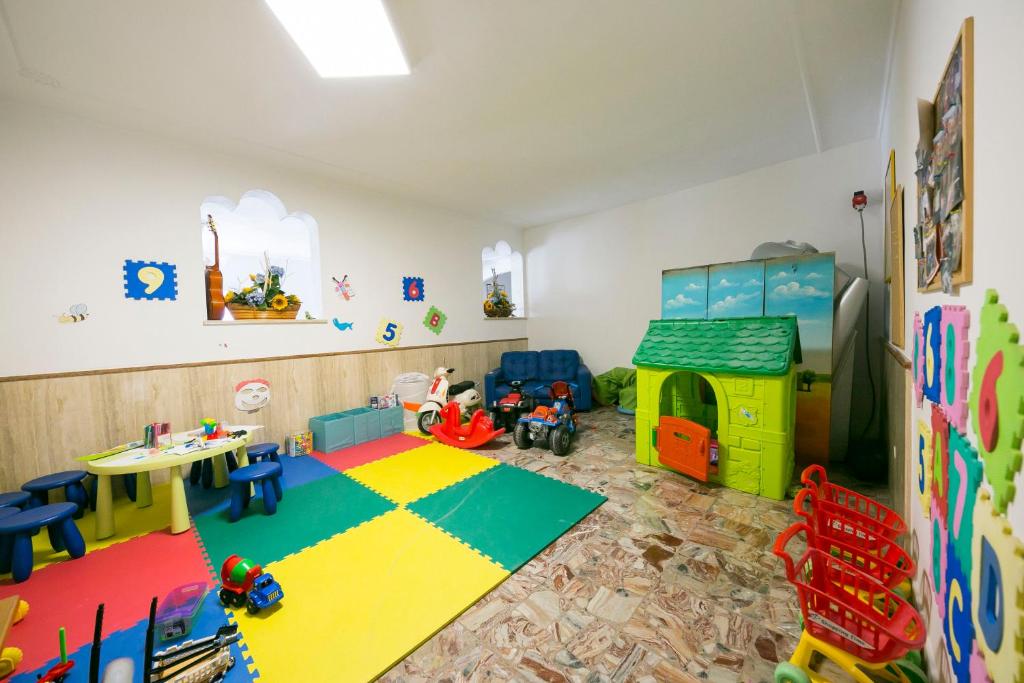 a room with a play room with toys in it at Hotel Maxim in Caorle