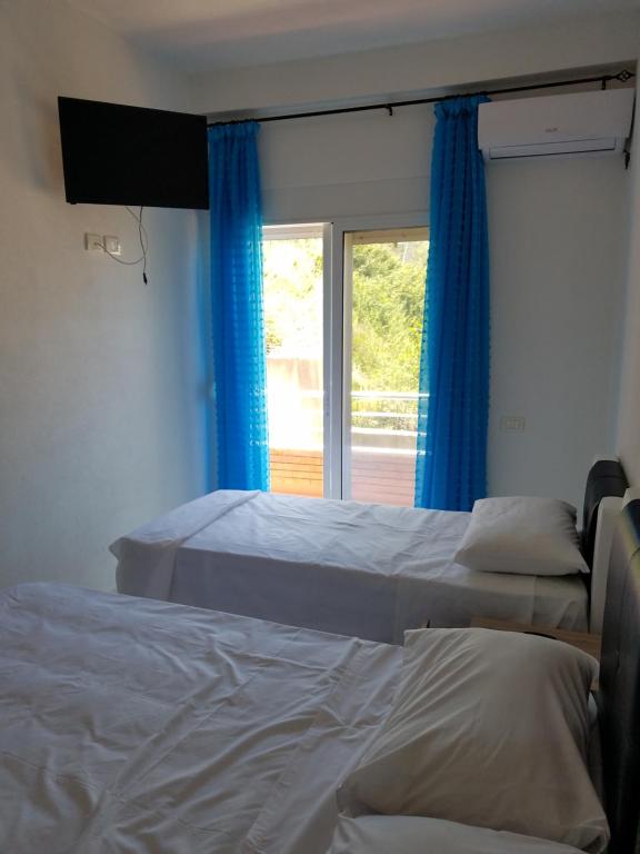 Postel nebo postele na pokoji v ubytování Sunset Hotel Roza