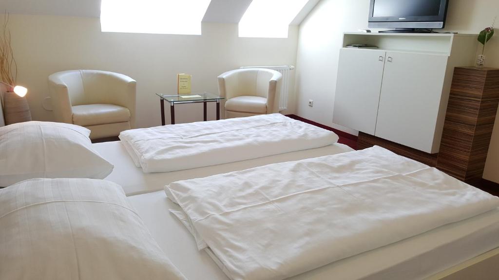 Postel nebo postele na pokoji v ubytování Gasthof zur Wachau