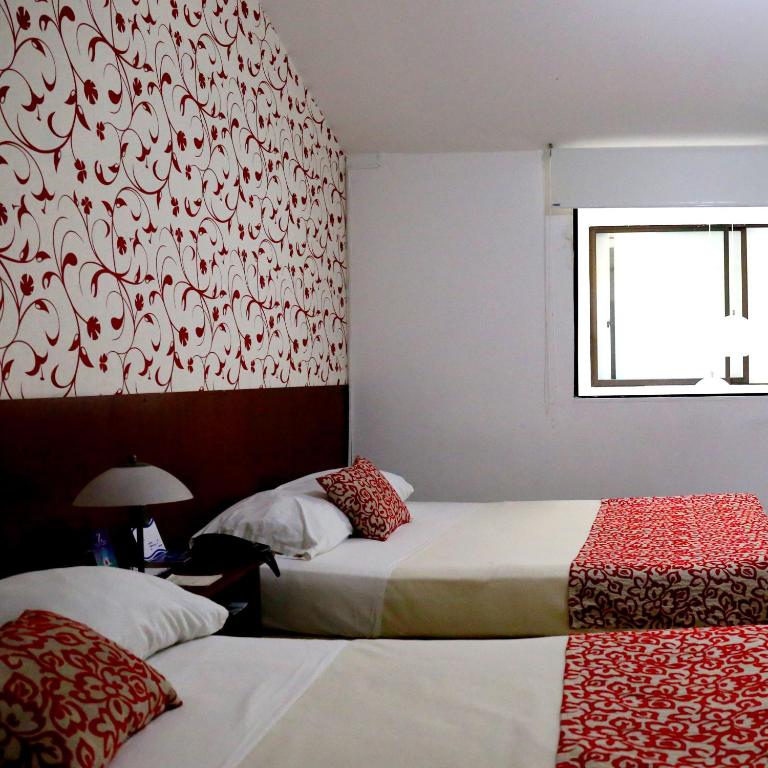 Postel nebo postele na pokoji v ubytování Hotel Zandu
