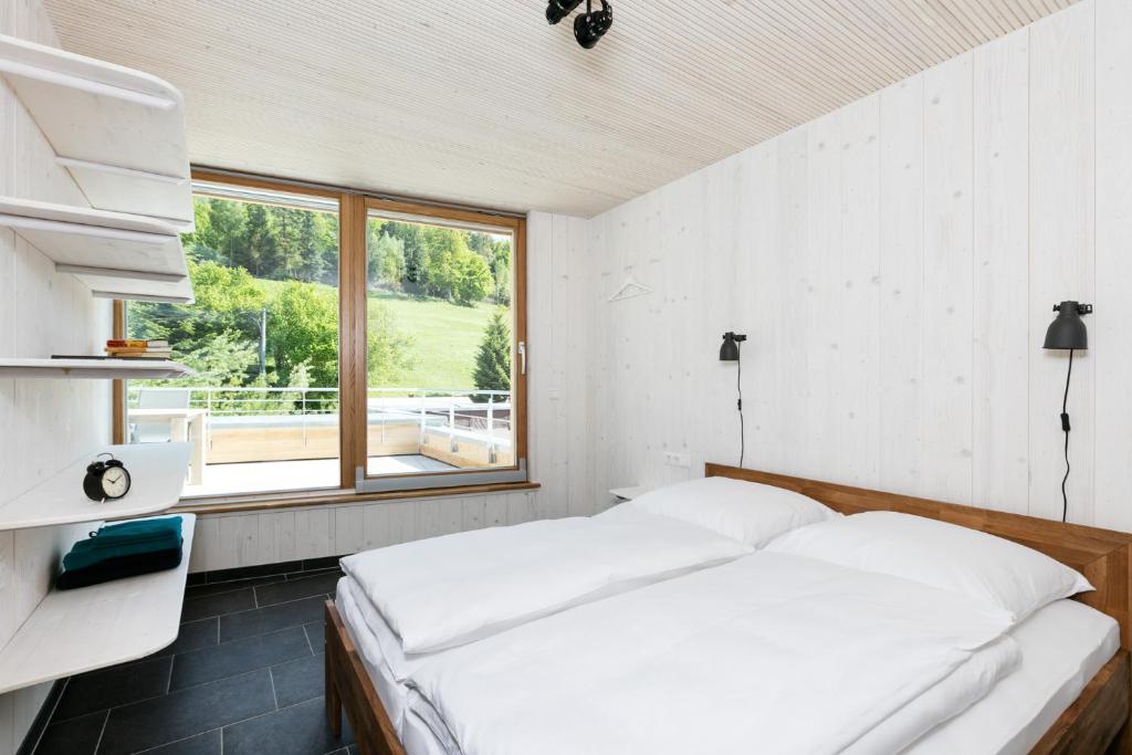 Postel nebo postele na pokoji v ubytování Schwarzwaldstrand Ferienwohnungen