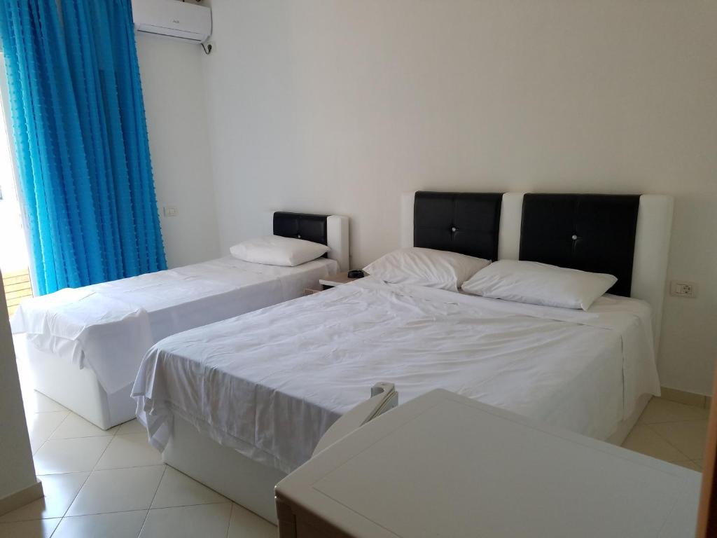 Postel nebo postele na pokoji v ubytování Sunset Hotel Roza