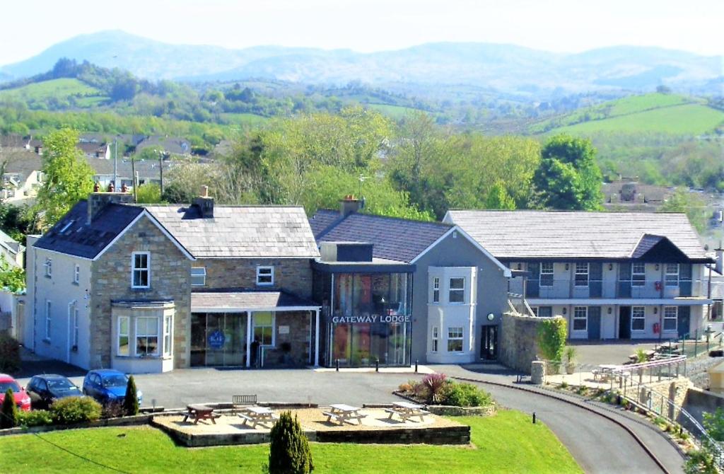 an aerial view of a house with mountains in the background at The Gateway Lodge in Donegal