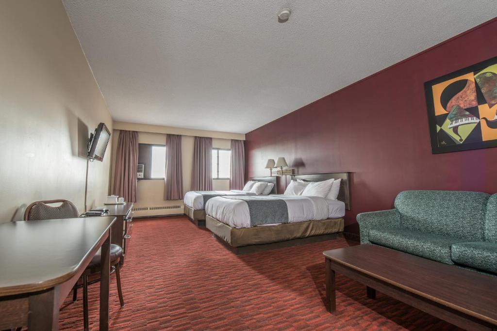 Postel nebo postele na pokoji v ubytování Argyll Plaza Hotel