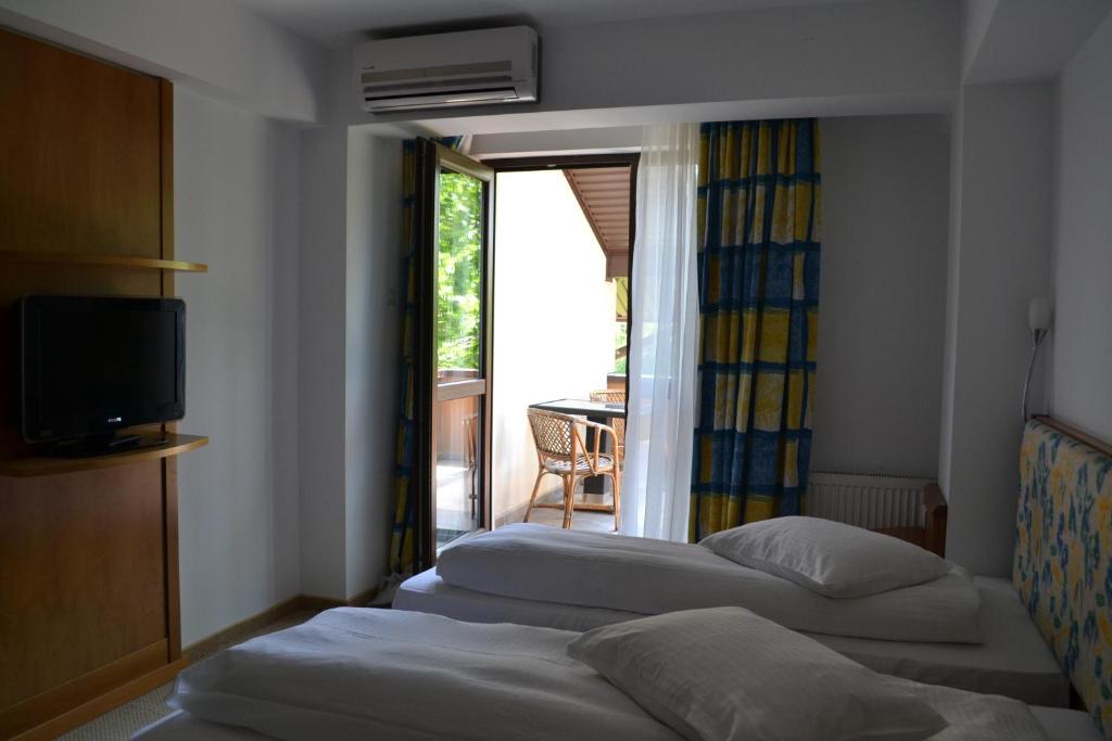 Postel nebo postele na pokoji v ubytování Hotel Doi Taurasi