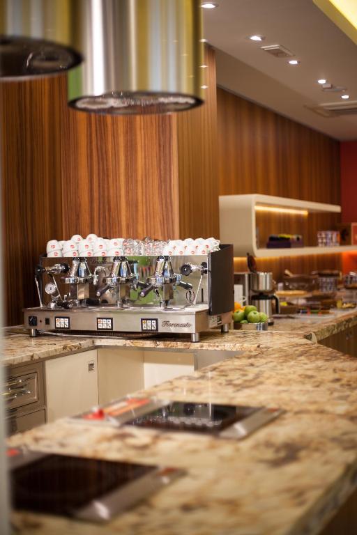 Kuchyň nebo kuchyňský kout v ubytování Hotel Aria