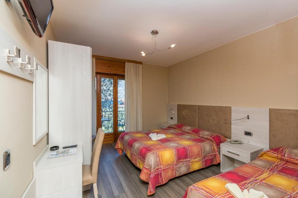 Postel nebo postele na pokoji v ubytování Garnì Casa Rabagno