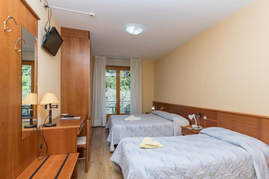 Postel nebo postele na pokoji v ubytování Garnì Casa Rabagno