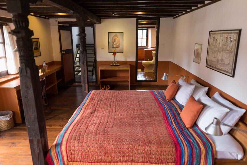 Postel nebo postele na pokoji v ubytování Milla Guesthouse Bhaktapur