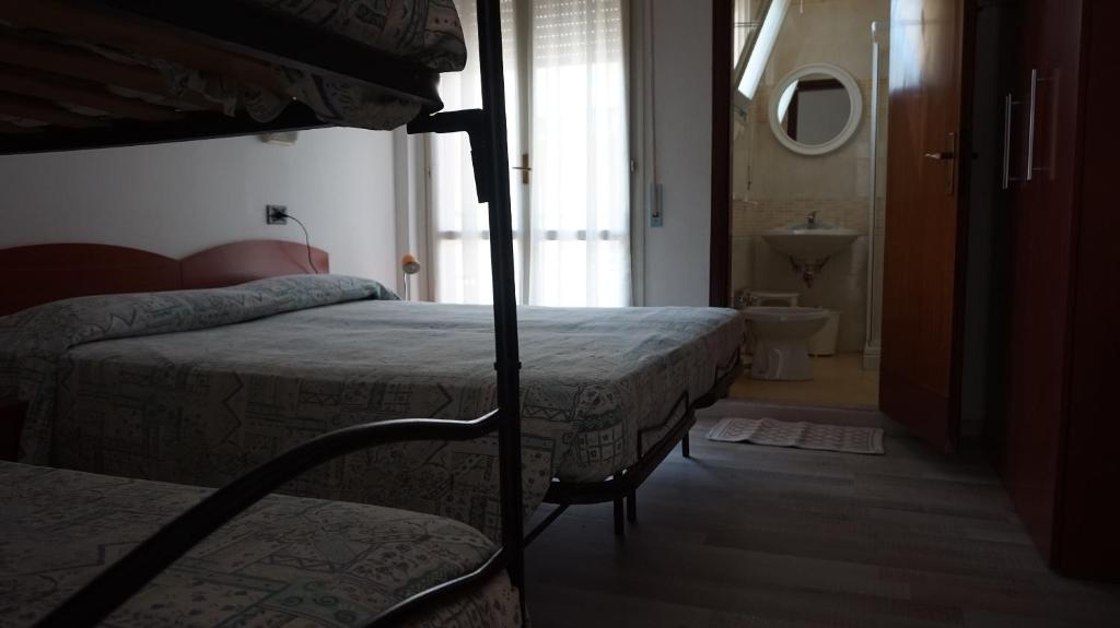 Postel nebo postele na pokoji v ubytování Hotel Daria