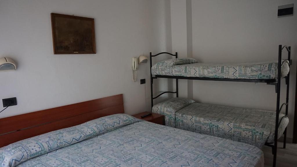 Postel nebo postele na pokoji v ubytování Hotel Daria