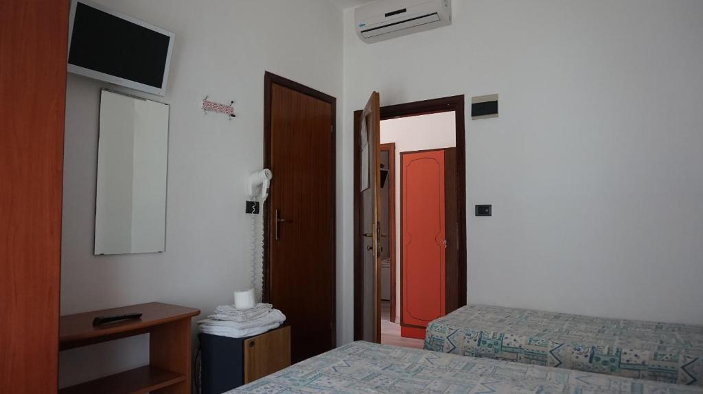 Postel nebo postele na pokoji v ubytování Hotel Daria