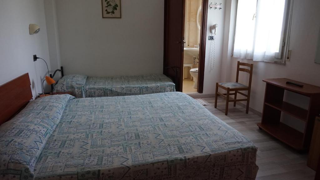 Postel nebo postele na pokoji v ubytování Hotel Daria